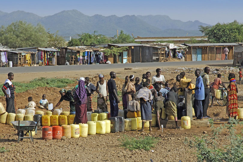 People standing in a queue to collect&lt;p&gt; clean drinking water, Kenya