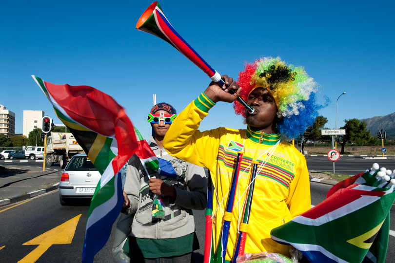 Street vendors from Zimbabwe selling &lt;p&gt;fan items in Cape Town