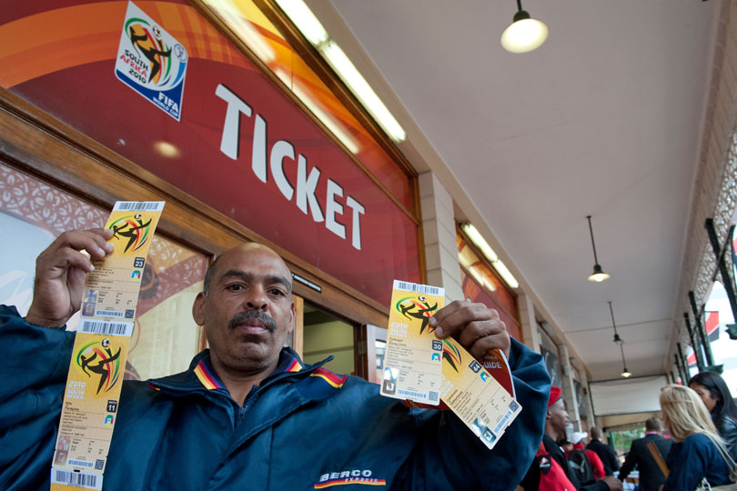 One of the first soccer fans to collect tickets