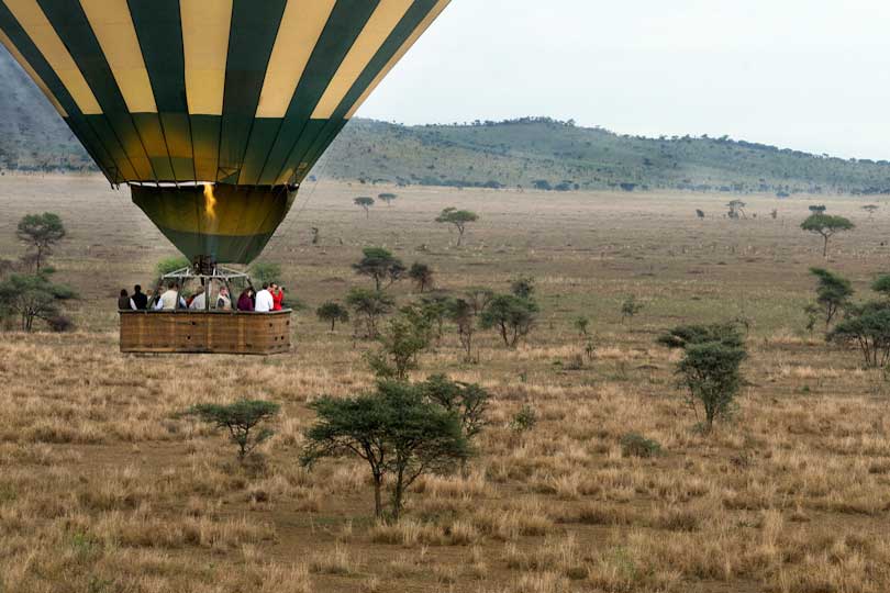 Clients flying in a hot air balloon over Serengeti National Park, Tanzania