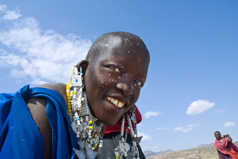 A Massai woman’s face is platterd with salt splashes
